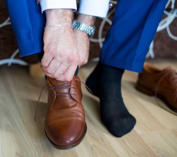 istock Business man knot shoe lace indoor 1277196382