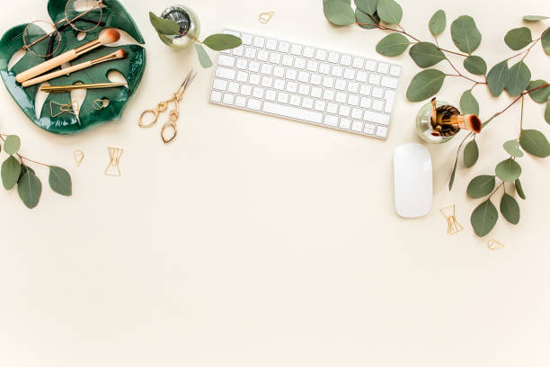 istock Flat lay home office desk. Female workspace with computer, plate sheet monstera, golden accessories, eucalyptus leaves, on beige background. Top view 1277196851