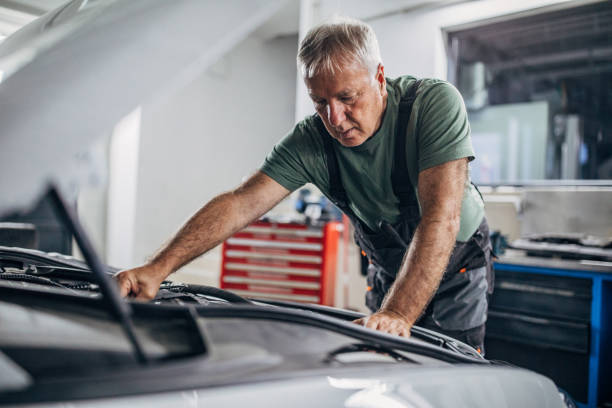 istock Mature man working in auto repair shop 1277198570