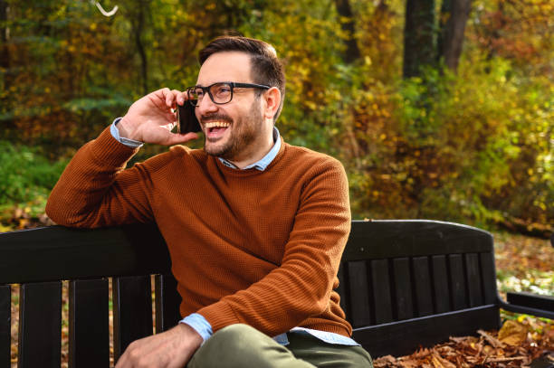 istock Man talking on smart phone outdoors 1277198741