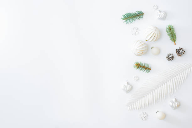 istock Flat lay frame with fir branches and christmas balls on a white background 1277200511