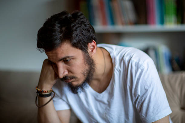 istock Unhappy depressed caucasian male sitting 1277201931