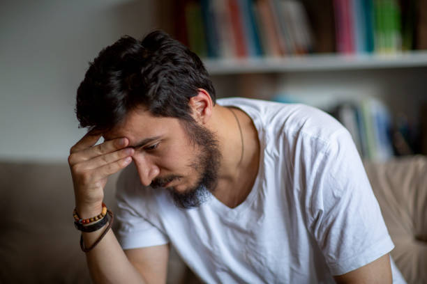 istock Unhappy depressed caucasian male sitting 1277201987