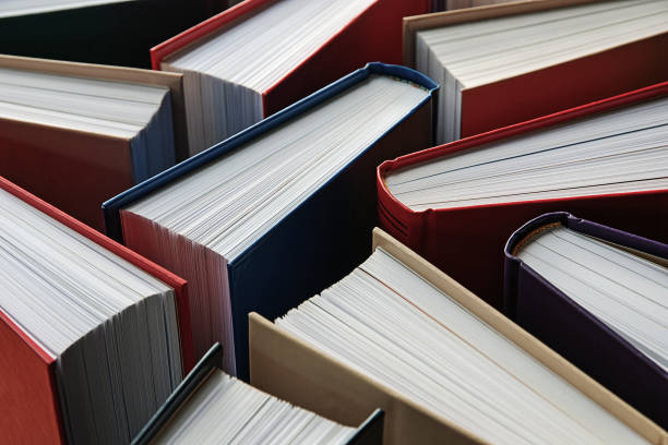istock many hardbound paper books standing, literature background 1277209152