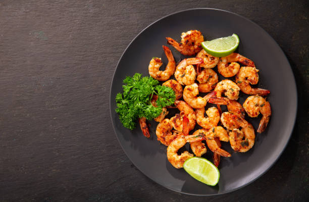 istock plate of grilled shrimps with lime, top view 1277210450