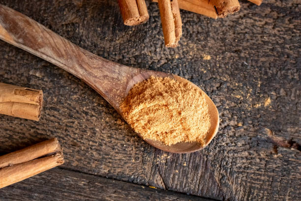 istock Ceylon cinnamon powder and cinnamon sticks on a table 1277211869