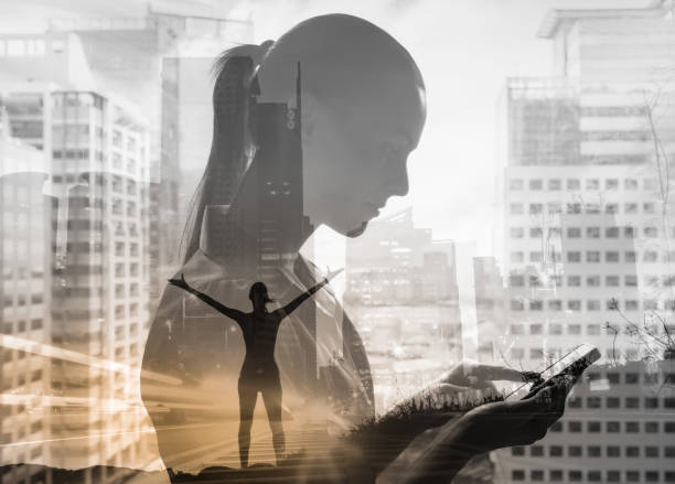 istock Woman in city setting using smartphone, and thinking positive thoughts. 1277214788