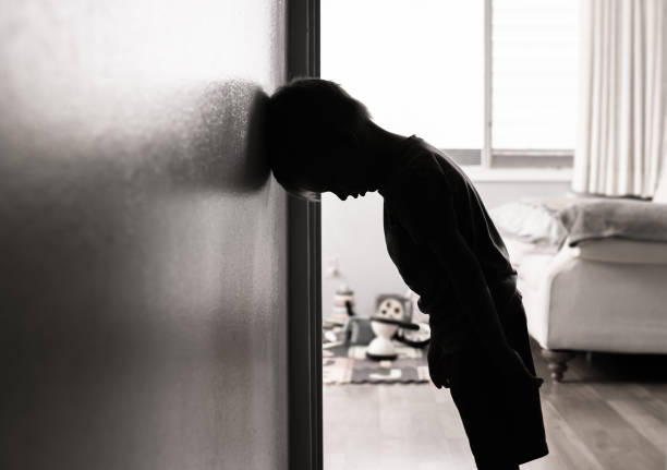 istock Sad little boy at home. 1277214953