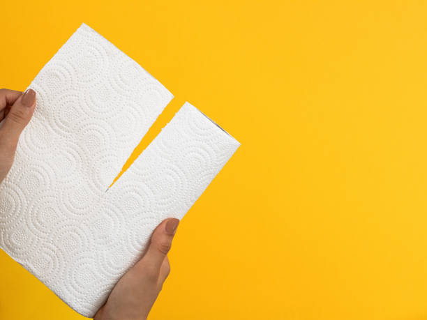 istock hands tearing roll of napkins 1277215026