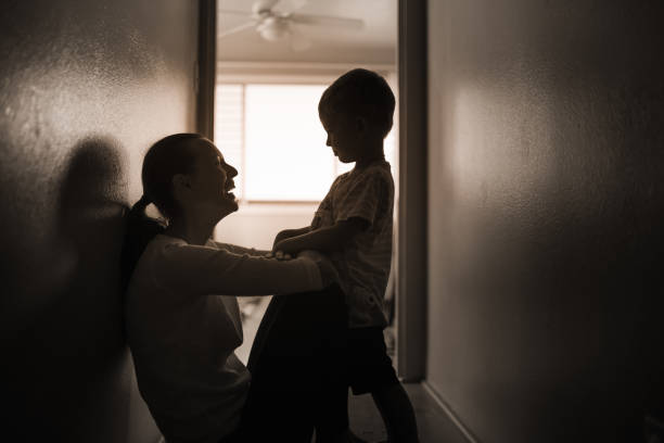 istock Mother and her little son at home talking together. 1277215136
