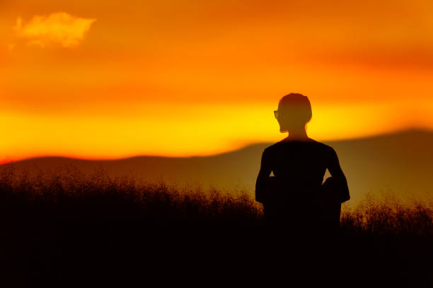 istock Woman feeling at peace in nature sunset. 1277215735