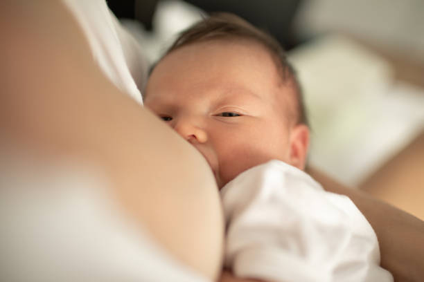istock Young mother breastfeeding her baby 1277215761