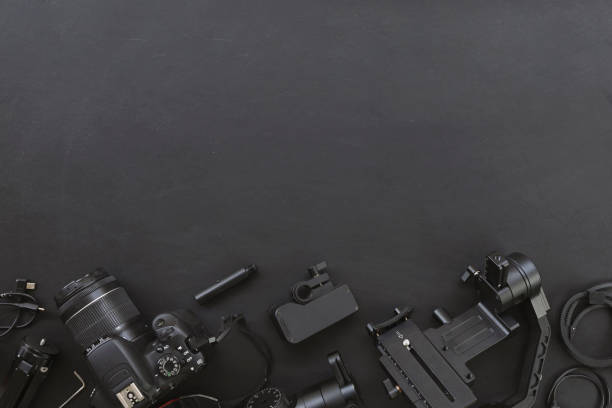 istock top view of work space photographer with digital camera and accessory on black background with copy space. flat lay 1277216297