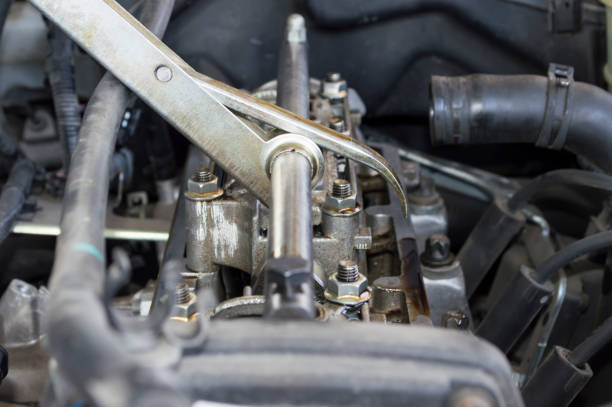 istock Side view of the engine with a special tool installed to adjust the valve clearance 1277217090