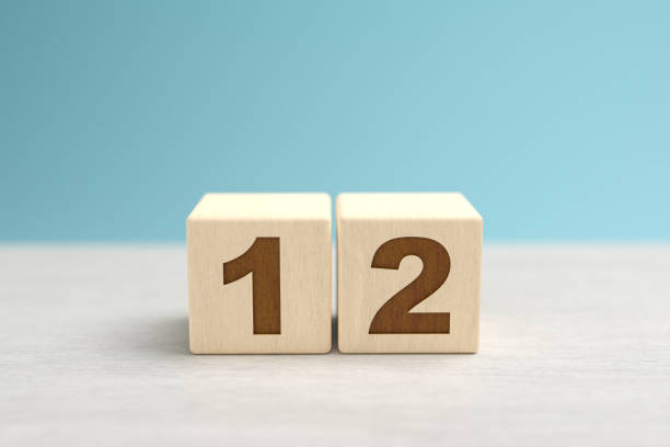 istock Wooden toy blocks forming the number 12. 1277218151