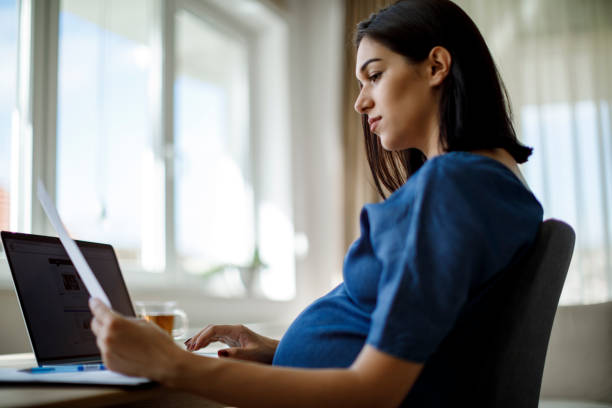 istock Pregnant woman working 1277221645