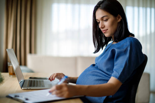 istock Pregnant woman working from home 1277221676