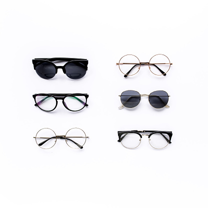 Female sunglasses on white background. Flat lay, top view. . High quality photo