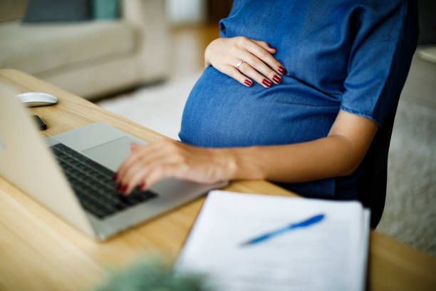 istock Pregnant woman working from home 1277221796