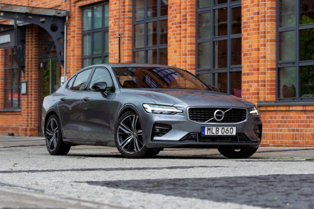 Volvo S60 on a street Rostock, Germany - 9th May, 2019: Volvo S60 parked on a street. This model is the first Volvo car produced in US. volvo stock pictures, royalty-free photos & images