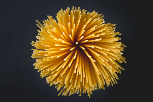 istock Uncooked pasta spaghetti on a black background stock photo 1277222924