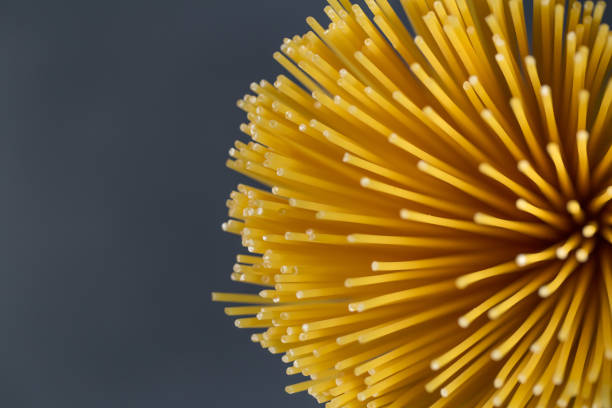 istock Uncooked pasta spaghetti on a black background stock photo 1277222941