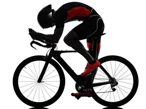 triathlete triathlon Cyclist cycling in studio silhouette shadow isolated on white background