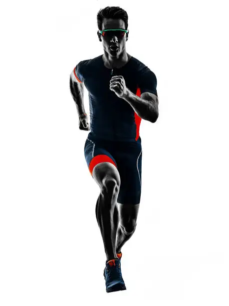 triathlete triathlon runner running in silhouette isolated on white background