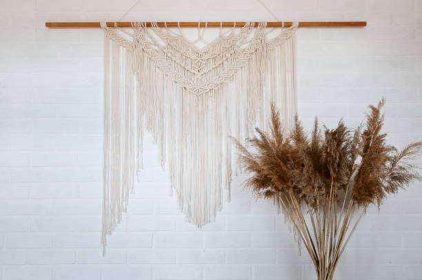 istock Beautiful boho macrame wall panel will add a cozy atmosphere and charm to any space in your home 1277224333