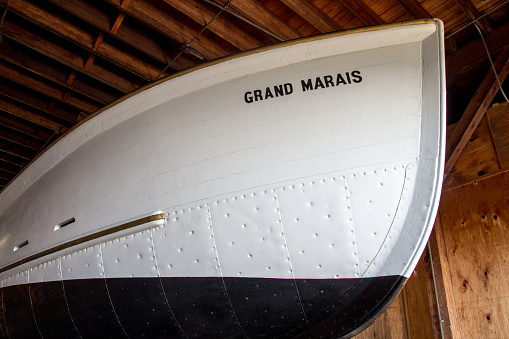 Munising, Michigan, USA - July 7, 2014: Bow of historical lifeboat Grand Marais on display at the former Coast Guard station in Pictured Rocks National Lakeshore.