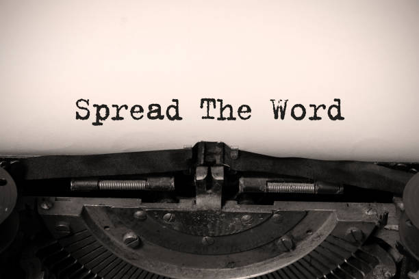 istock Word writing text Spread The Word on a vintage typewriter. 1277226494