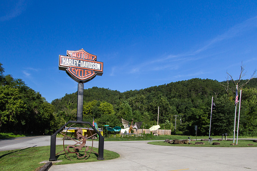 Maryville, Tennessee, USA - August 12, 2020: Sign for the Smoky Mountain Harley Davidson located on the Tail of the Dragon trail near Deals Gap in the Appalachian Mountains of Tennessee.