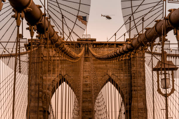 Details of Brooklyn Bridge and skyscrapers in New York City.