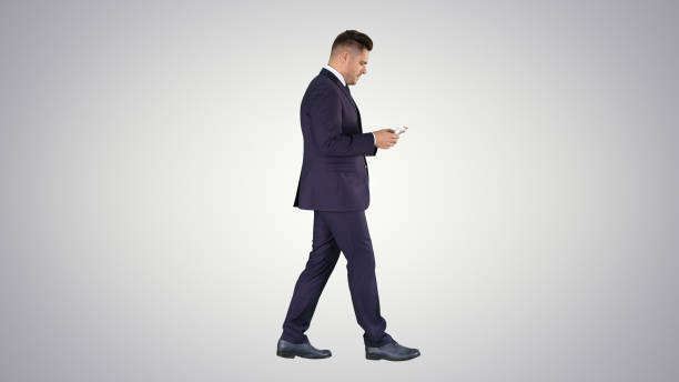 istock Rich man counts the money walking on gradient background 1277232386
