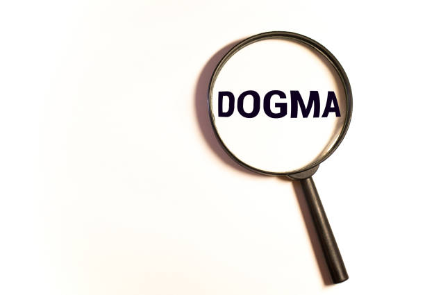 istock text: DOGMA on magnifying glass. 1277232469