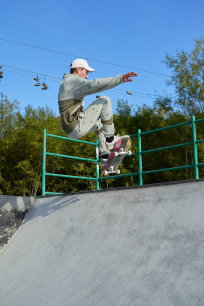 istock Skateboarder jumps up from the ramp 1277236128