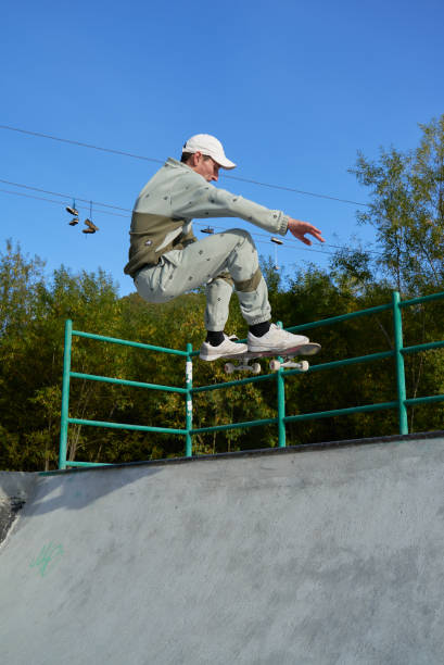 istock Skateboarder jumps up from the ramp 1277236133