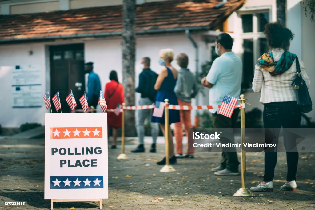 Waiting in line on Election Day Diverse people waiting in line for voting on Election Day Voting Stock Photo