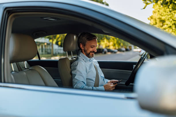 istock Man in a car, business person. 1277242819