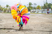 istock Balloon seller in the beach 1277246481