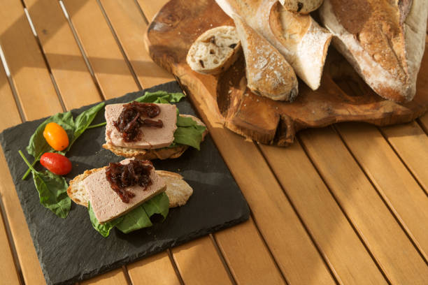istock bruschetta with liver pate and onion jam on a black plate and wooden table 1277246499