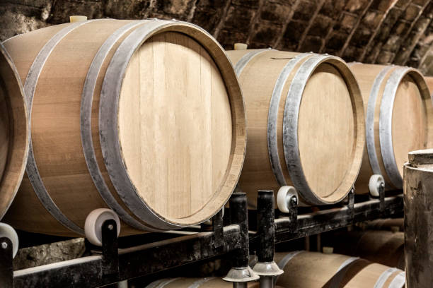 istock Wine barrels stacked in the old cellar of the winery. 1277249459
