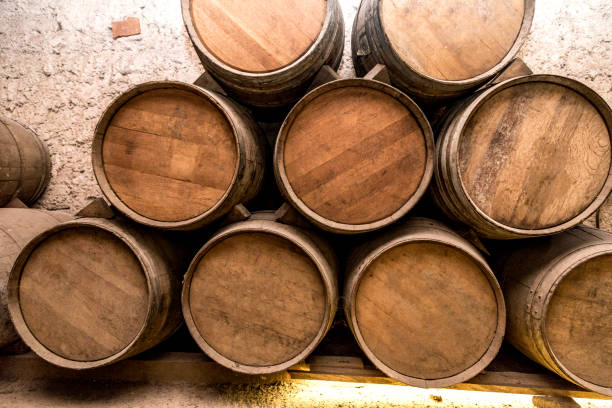 istock Wine barrels stacked in the old cellar of the winery. 1277249518
