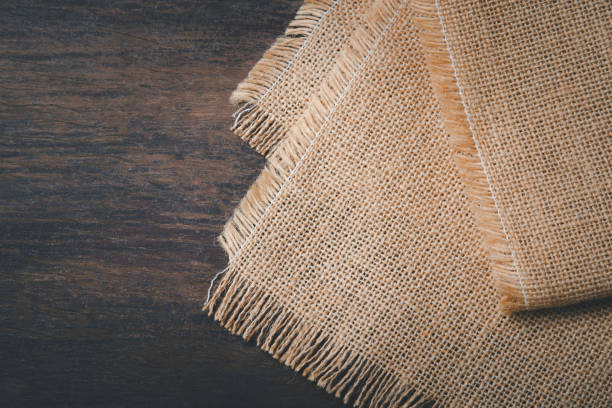 istock vintage hemp sack tablecloth on the old dark wooden table texture flat lay top view for product presentation 1277251981