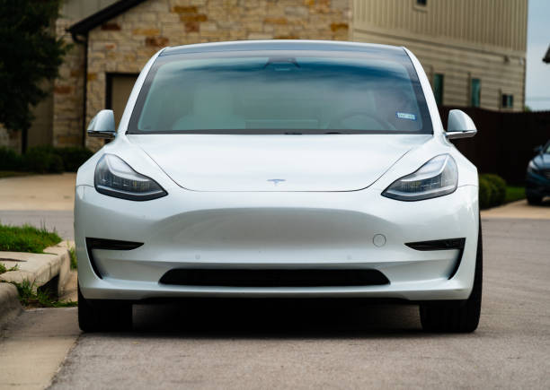 Environmental Luxury Living Austin, TX, USA - September 15, 2020: front view of a White Tesla Model 3 The American Made Electric sports car motor living stock pictures, royalty-free photos & images