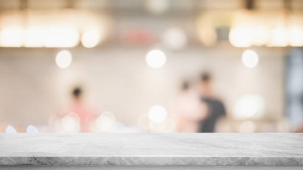 istock Empty white marble stone table top and blur glass window interior cafe and restaurant banner mock up abstract background - can used for display or montage your products. 1277257381