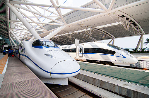 JUL 8, 2010 Changsha, China - China high speed train model CRH2C and CHR3C wait to departure under modern white roof structure of Changsha station