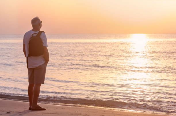 istock A man admires the sunset on the sea 1277260632