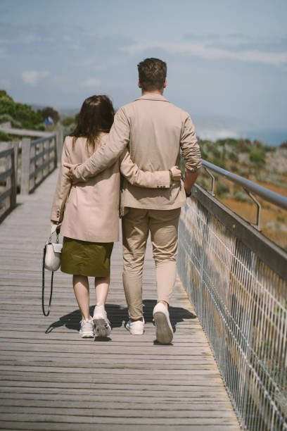istock Couple on vacation wlking on a bridge 1277263147