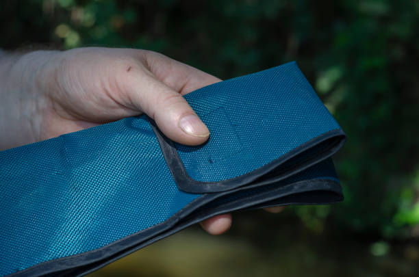 istock A man's hand removes the baitcasting rod from the case. 1277266549